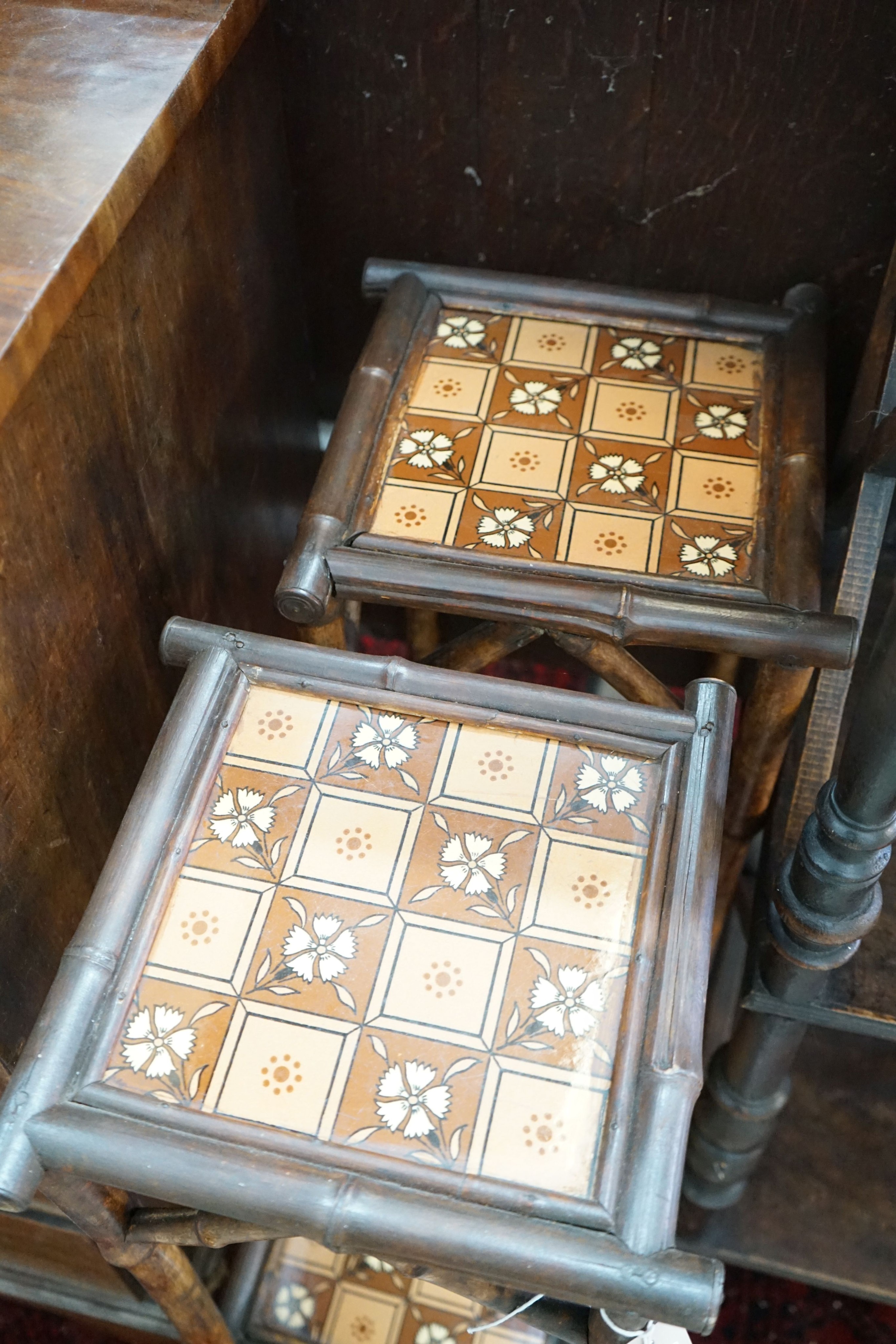 A pair of late Victorian tiled bamboo two-tier plant stands, height 74cm